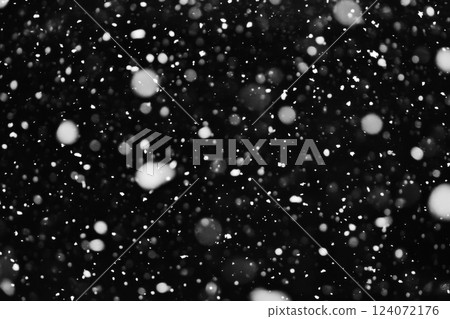 Snow falling on black background at night 124072176