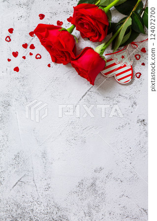 Valentine's Day Concept. Red roses and heart decor on Ultimate Gray background. Space for text or design. Top view flat lay. 124072700