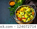 Sabji, Stewed pumpkin with soft cheese and vegetables on a dark stone table. Traditional Indian food. Copy space. 124072714