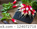 Harvest organics red radish. Organic vegetables. Fresh Radishes on wooden background. 124072718