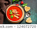 Traditional homemade gazpacho cold soup. Tomato soup puree gazpacho with tomatoes served seafood on a stone background. 124072720