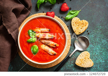 Traditional homemade gazpacho cold soup. Tomato soup puree gazpacho with tomatoes served seafood on a stone background. 124072720