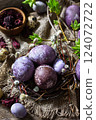 Easter egg dye purple. Homemade Eggs are painted with natural egg dye from dried hibiscus flowers on rustic table. 124072722