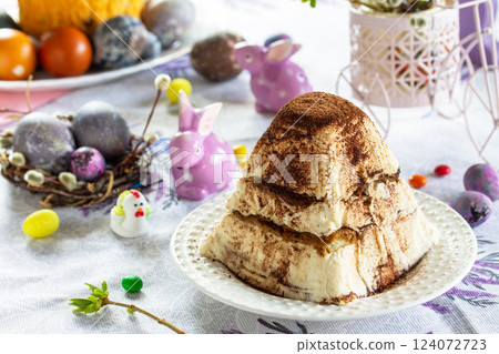 Easter background. Dessert Easter cottage cheese on festive table. 124072723
