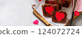 St. Valentine's Day, Mother's Day or Birthday festive dessert. Homemade sweet chocolate brownie with hearts for Valentine's Day on a stone countertop. Banner. 124072724