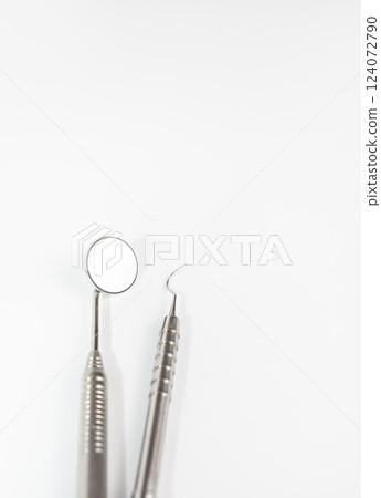 Isolated Basic Dental Instruments Set, Mirror, Explorer. Oral Hygiene Mockup, Dental Care. Healthcare. Vertical. Copy Space Isolated Basic Dental Instruments Set, Mirror, Explorer. Oral Hygiene Mockup, Dental Care. Healthcare. Vertical. Copy Space 124072790