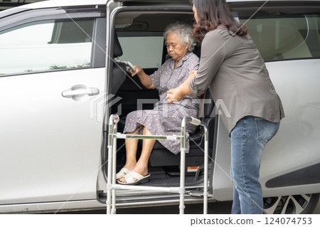 Asian senior woman patient sitting on walker prepare get to her car, healthy strong medical concept. 124074753