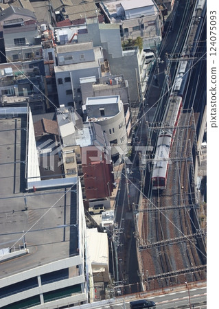 A train on the Kintetsu Minami Osaka Line departing from Osaka Kintetsu Abeno Station 124075093
