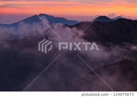 Mount Shiomi and Mount Senjo at dawn as seen from Mount Akaishi in the Southern Alps Mount Shiomi and Mount Senjo at dawn as seen from Mount Akaishi in the Southern Alps 124075673