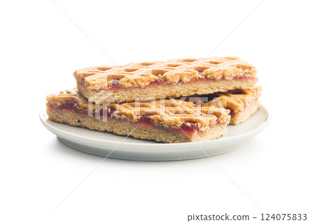 Sweet linzer cake on plate  isolated on white background. 124075833