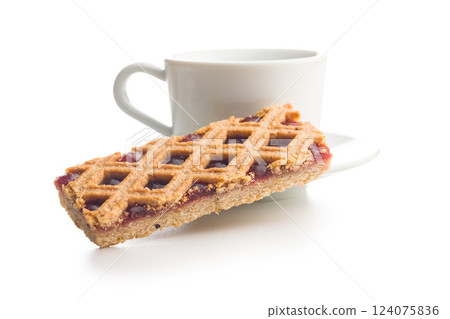 Sweet linzer cake and coffee cup  isolated on white background. 124075836