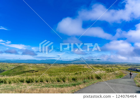 Aso City, Kumamoto Prefecture A person in a wheelchair strolls along the promenade of Aso's caldera, seen from Daikanbo in autumn Aso City, Kumamoto Prefecture A person in a wheelchair strolls along the promenade of Aso's caldera, seen from Daikanbo in autumn 124076464