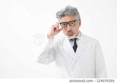 Middle-aged man wearing a white coat 124076589