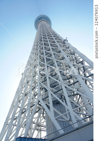 Tokyo, Japan - 2 March, 2025: Tokyo Skytree, a broadcasting and observation tower in Tokyo, Japan. Tokyo, Japan - 2 March, 2025: Tokyo Skytree, a broadcasting and observation tower in Tokyo, Japan. 124076913