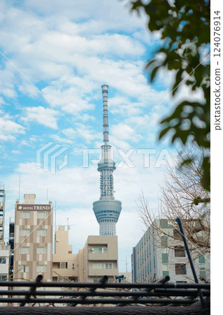 Tokyo, Japan - 2 March, 2025: Tokyo Skytree, a broadcasting and observation tower in Tokyo, Japan. Tokyo, Japan - 2 March, 2025: Tokyo Skytree, a broadcasting and observation tower in Tokyo, Japan. 124076914