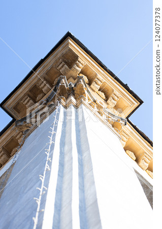 A Stunning Architectural Detail Captured in Perspective Featuring Ornate Cornices Under a Clear Blue Sky 124077378