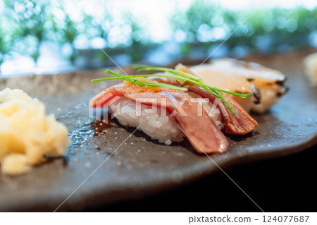 Lightly torched otoro sushi with a golden seared surface and a tender texture 124077687