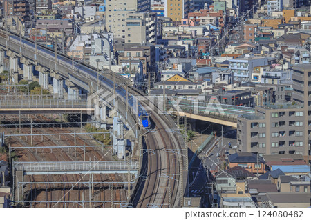 Train on Elevated Tracks in an Urban Cityscape, Tokyo Dec 6 2024 124080482