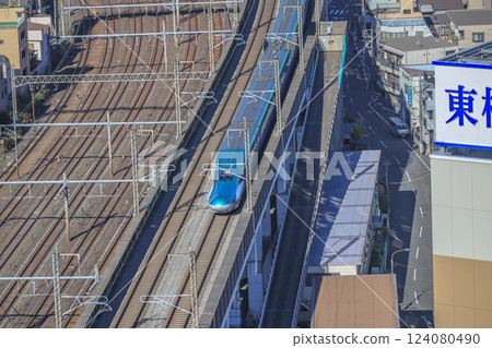 Train Passing Through an Urban Railway Station, Tokyo Dec 6 2024 124080490