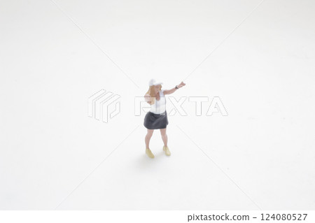 Miniature Figurine Depicting Recreational Activity on Clean Miniature Figurine Depicting Recreational Activity on Clean 124080527