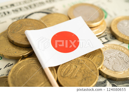 Japan flag on coin and banknote money, finance trading investment business currency. Japan flag on coin and banknote money, finance trading investment business currency. 124080655