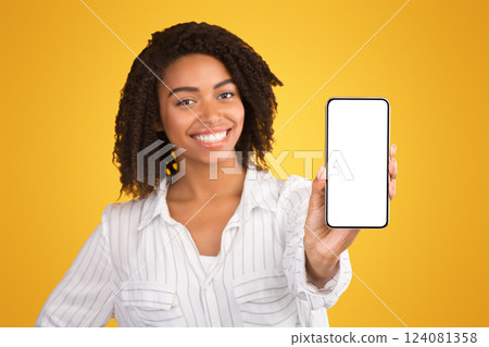 Modern Technology Concept. African american woman showing blank phone screen, mockup, selective focus 124081358
