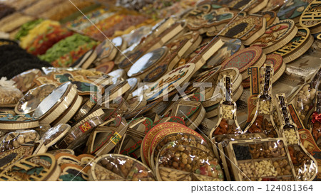 folk container with dried nut which is  the souvenir for tourists in Osh Bazaar. Osh Bazaar is one of biggest bazaar in Kyrgyzstan. 124081364