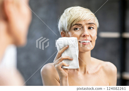 Facial Hygiene. Lady Drying Face Using Towel During Morning Skincare Routine In Bathroom At Home. Panorama, Selective Focus Facial Hygiene. Lady Drying Face Using Towel During Morning Skincare Routine In Bathroom At Home. Panorama, Selective Focus 124082261