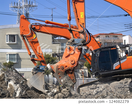 Demolition work using heavy machinery: Crusher 124082279