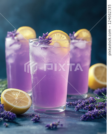 Refreshing Lavender Lemonade Cocktail with Floral Garnish on Rustic Wooden Table 124082335