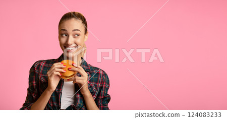 Cheat Meal. Pretty Lady Eating Hamburger Over Yellow Studio Background. Free Space Cheat Meal. Pretty Lady Eating Hamburger Over Yellow Studio Background. Free Space 124083233