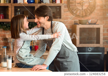Father Daughter Connection. Cute Little Girl Bonding With Dad In Kitchen, Having Fun While Preparing Bakery Together 124083258