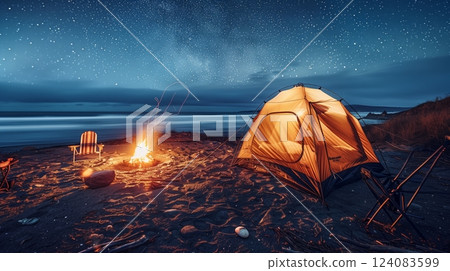 A cozy beach tent by a crackling campfire, waves crashing, and starry skies create the perfect escape. 124083599