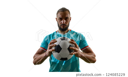 Focused football athlete gripping ball with both hands, intensely look at camera, with determination in eyes against white background. 124085229