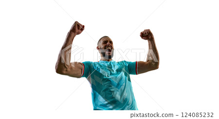 Intense portrait of young football player in blue uniform shouting in celebration holding fists raised. Concept of sport energy, championship, Intense portrait of young football player in blue uniform shouting in celebration holding fists raised. Concept of sport energy, championship, 124085232