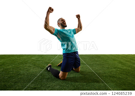 Passionate footballer celebrating victory, kneeling on grass, fists clenched, roaring in triumph, emotions pouring after decisive match. Passionate footballer celebrating victory, kneeling on grass, fists clenched, roaring in triumph, emotions pouring after decisive match. 124085239