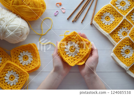 Crochet handmade granny square pattern, crocheting supplies, assorted colored wool yarn, hook, knitting crocheting 124085538