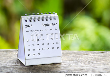 September 2025 white table calendar with outdoor background. Calendar concept September 2025 white table calendar with outdoor background. Calendar concept 124086189