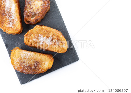 Traditional Spanish torrijas for Holy Week isolated on white background Traditional Spanish torrijas for Holy Week isolated on white background 124086297