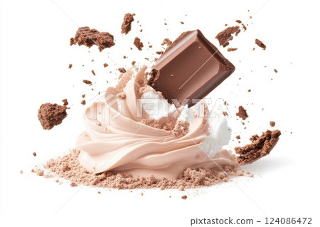 The image shows chocolate and cream that fly apart and form a decorative mess. The chocolate bar and crumbs smoothly join the composition, creating an appetizing and dynamic effect. 124086472