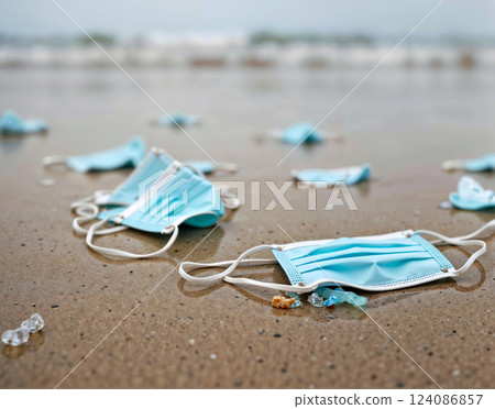 A beach littered with used face masks A beach littered with used face masks 124086857