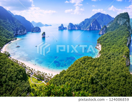 A beautiful beach with a large body of water in the background A beautiful beach with a large body of water in the background 124086859