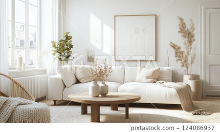 A white living room with a white sectional sofa, a wooden coffee table, and a large window. Sunlight streams through the window, illuminating the room A white living room with a white sectional sofa, a wooden coffee table, and a large window. Sunlight streams through the window, illuminating the room 124086937