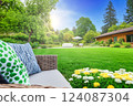 UK garden with naturalistic design yard, green lawn with flowers,  summer retreat house 124087304