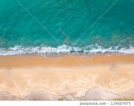 Top view Beautiful beach nature sea,Amazing landscape waves crashing on sand in summer background,Wide angle drone shot Top view Beautiful beach nature sea,Amazing landscape waves crashing on sand in summer background,Wide angle drone shot 124087975