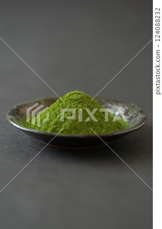 Matcha powder served on a small plate Matcha powder served on a small plate 124088232