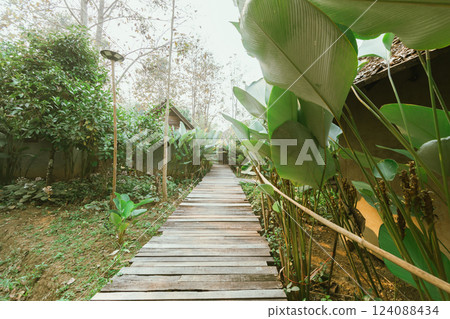 Local wooden house with tropical garden Local wooden house with tropical garden 124088434