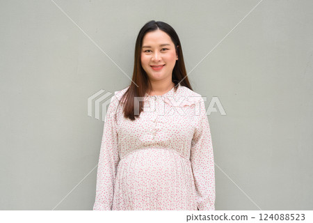 Pregnant woman looking at camera 124088523