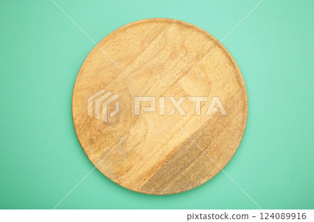 Empty wooden tray on mint background. Rectangular wooden dish Empty wooden tray on mint background. Rectangular wooden dish 124089916