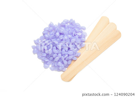 Sticks of wood for wax and spa with wax granules isolated on white background 124090204